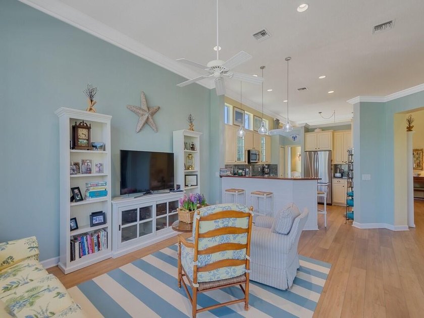 This pool home features a 2022 roof, laminate flooring - photo 14