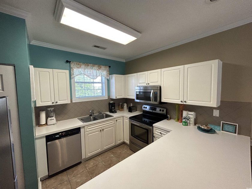 GORGEOUS REMODELED SECOND FLOOR TWO BEDROOM VILLLA IN - photo 16