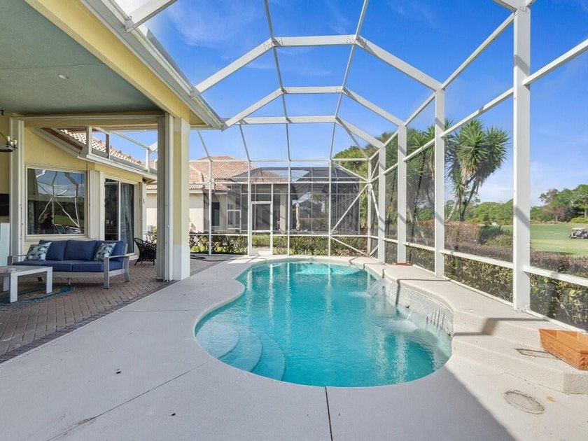 This pool home features a 2022 roof, laminate flooring - photo 20