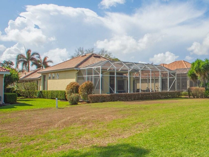 This pool home features a 2022 roof, laminate flooring - photo 21