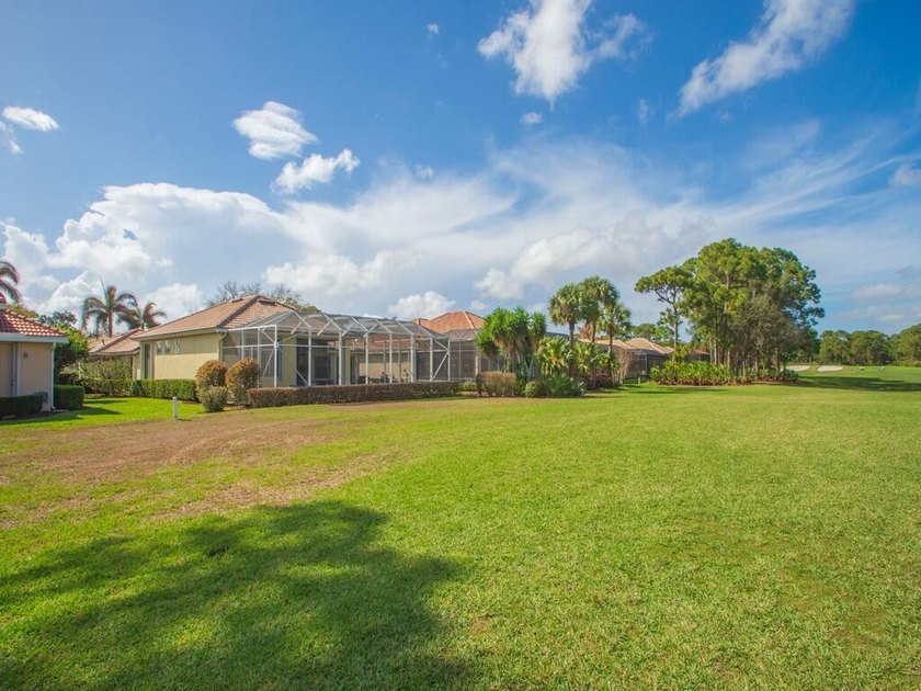 This pool home features a 2022 roof, laminate flooring - photo 22