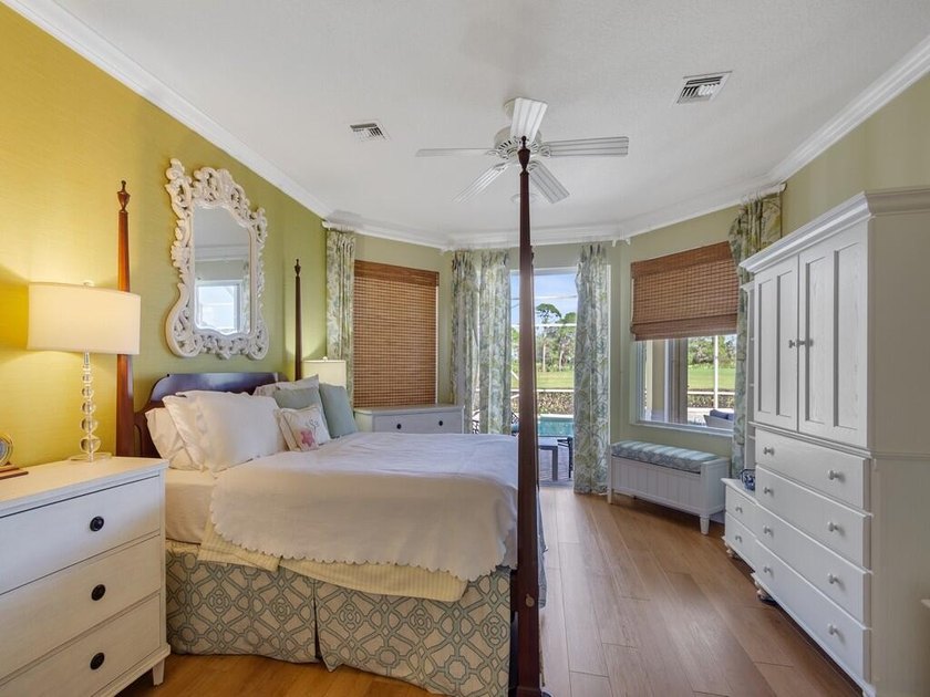 This pool home features a 2022 roof, laminate flooring - photo 25