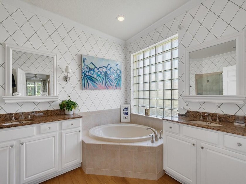This pool home features a 2022 roof, laminate flooring - photo 27