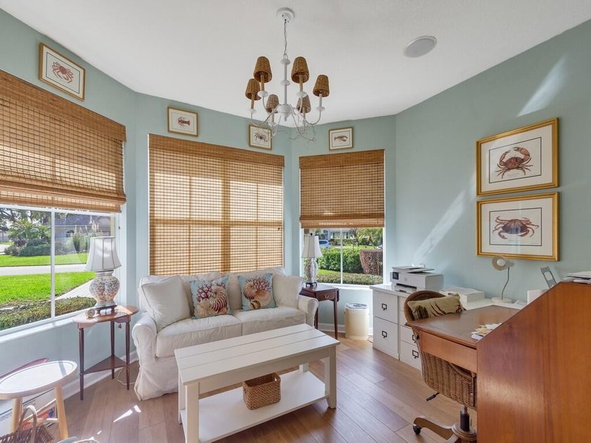 This pool home features a 2022 roof, laminate flooring - photo 30