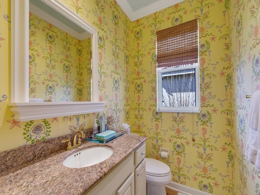 This pool home features a 2022 roof, laminate flooring - photo 31