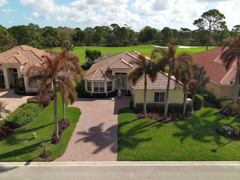This pool home features a 2022 roof, laminate flooring - photo 34