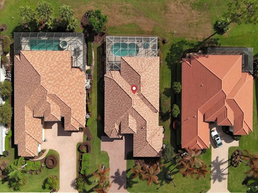 This pool home features a 2022 roof, laminate flooring - photo 35
