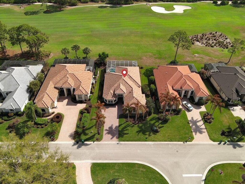This pool home features a 2022 roof, laminate flooring - photo 36