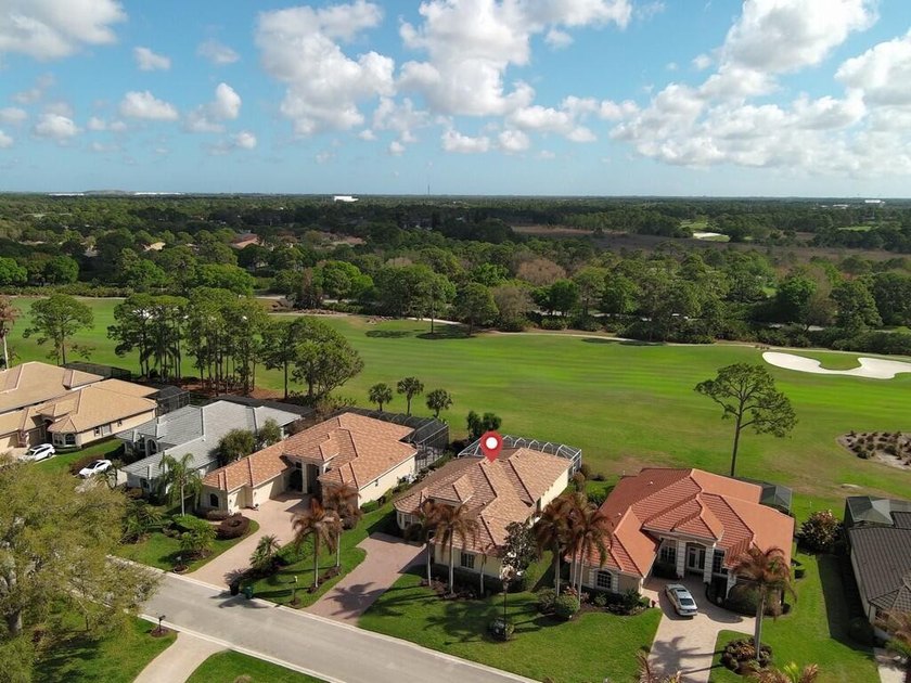 This pool home features a 2022 roof, laminate flooring - photo 37