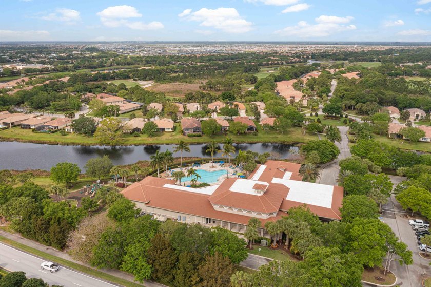 This pool home features a 2022 roof, laminate flooring - photo 40