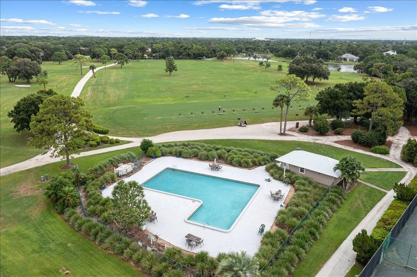 This pool home features a 2022 roof, laminate flooring - photo 47