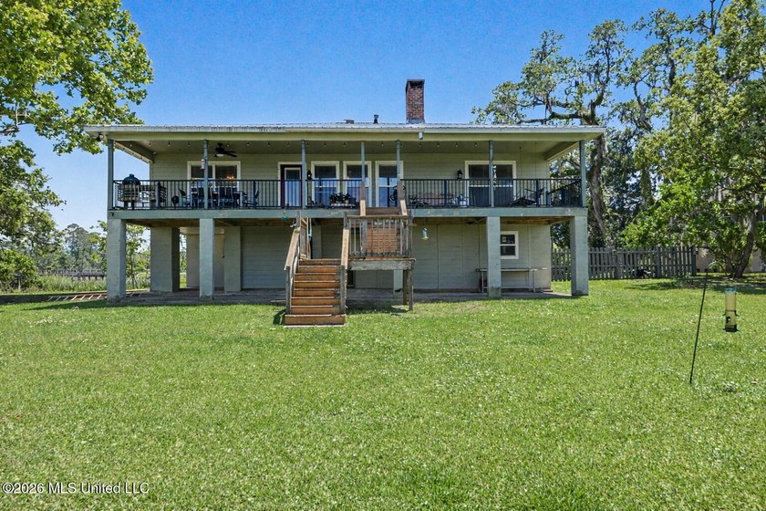 Beautiful Deep Waterfront home with a large pier and covered - photo 32
