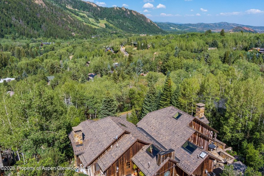 Nestled among a serene grove of mature aspens in one of Aspen's - photo 3