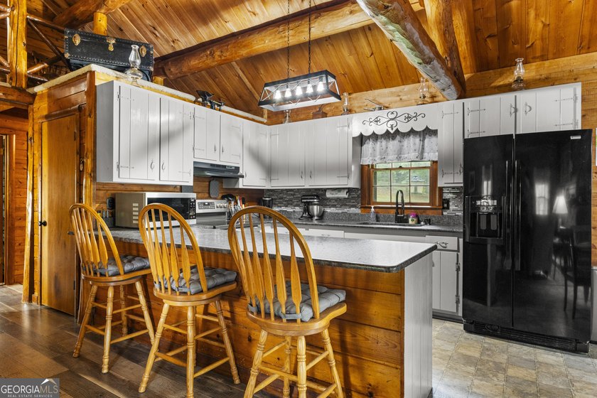 Rustic charm meets modern comfort in this beautiful log home - photo 8