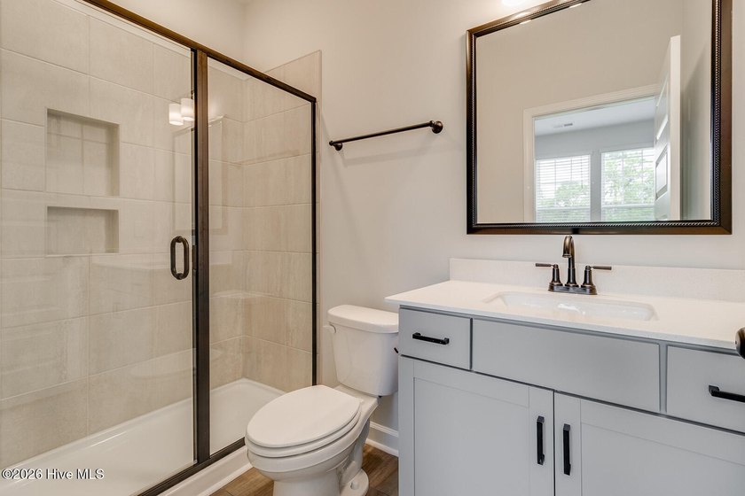 The Nottely is a two-story home with five bedrooms and three and - photo 12
