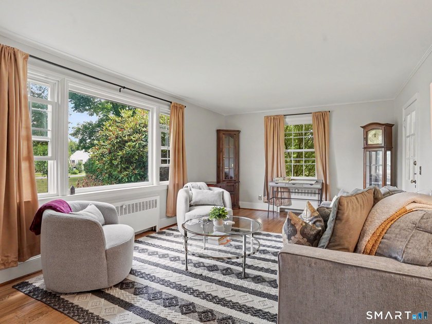 Welcome home to this charming Cape nestled in a sought-after - photo 3