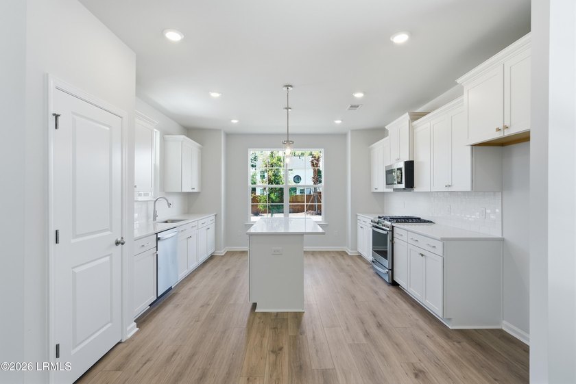 This two-story home includes three bedrooms and two-and-one-half - photo 7