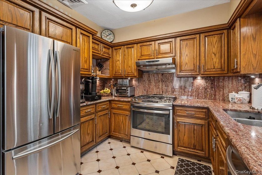 Rarely Available in Coveted Beechhurst! This impeccably - photo 8