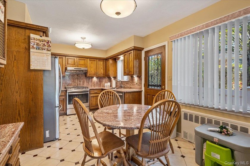 Rarely Available in Coveted Beechhurst! This impeccably - photo 9