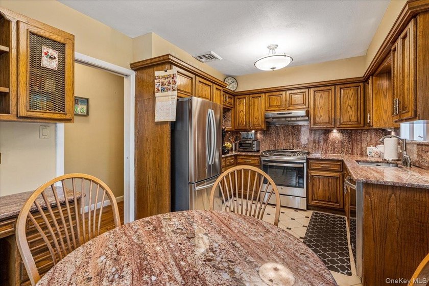 Rarely Available in Coveted Beechhurst! This impeccably - photo 10