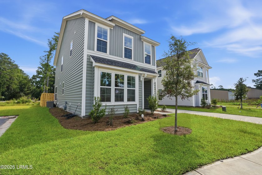 This two-story home includes three bedrooms and two and one-half - photo 3