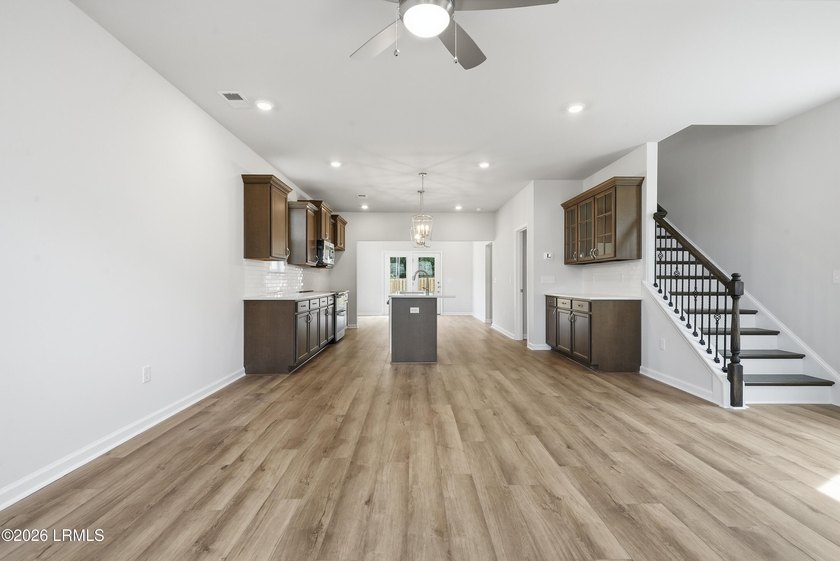 This two-story home includes three bedrooms and two and one-half - photo 4