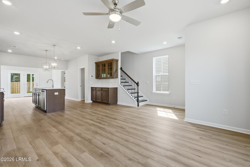 This two-story home includes three bedrooms and two and one-half - photo 5