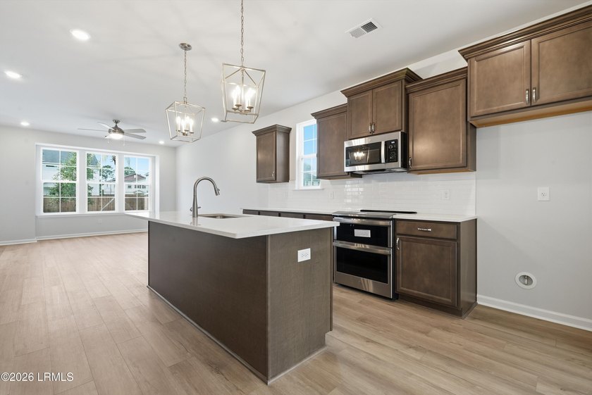 This two-story home includes three bedrooms and two and one-half - photo 10