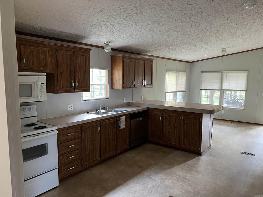Nestled on 20 beautiful wooded acres, this 3-bedroom, 2-bath - photo 13