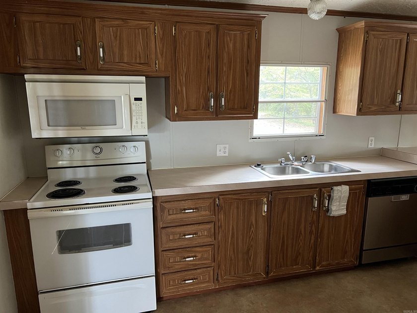Nestled on 20 beautiful wooded acres, this 3-bedroom, 2-bath - photo 17