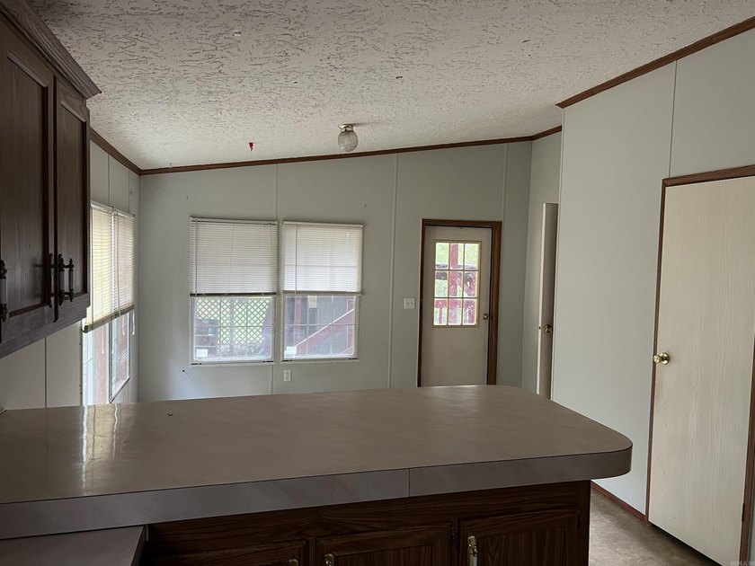 Nestled on 20 beautiful wooded acres, this 3-bedroom, 2-bath - photo 18