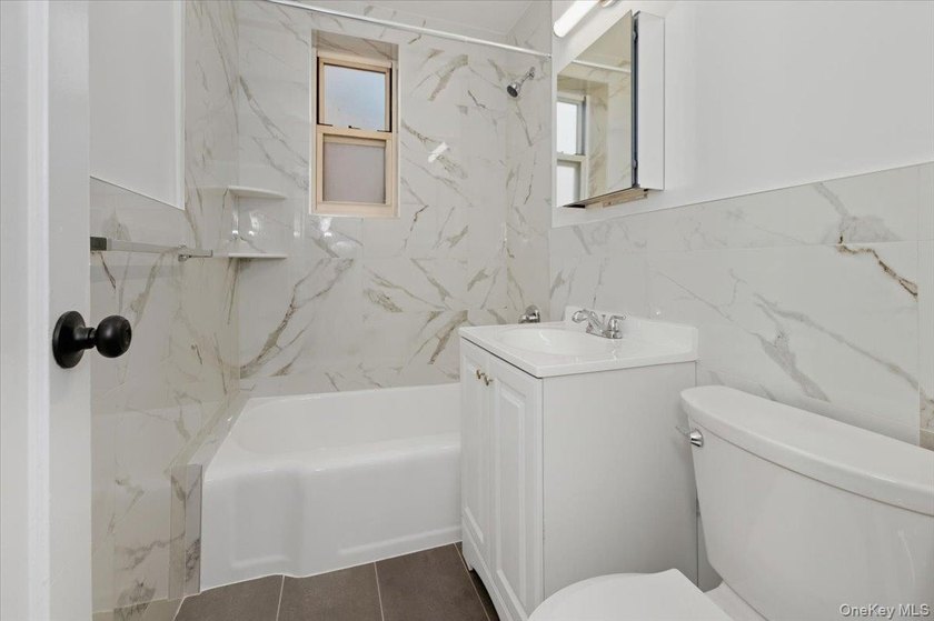 Step into style and comfort in this beautifully renovated studio - photo 8