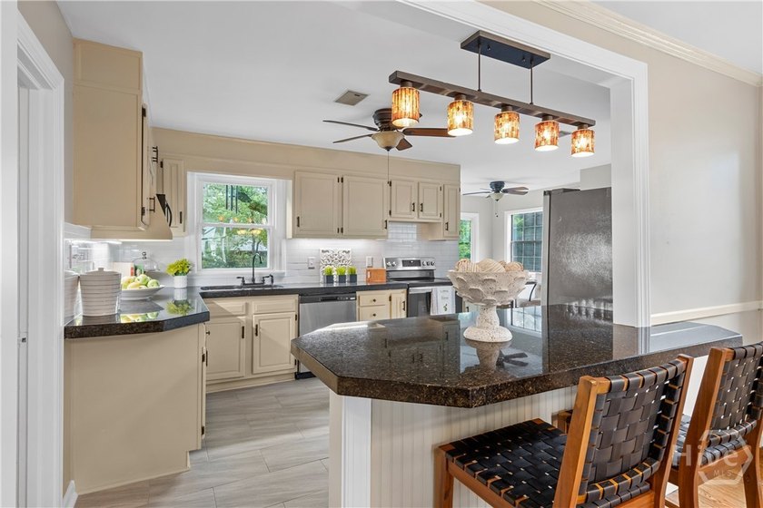 Nestled in the heart of Isle of Hope on large corner lot, this - photo 14
