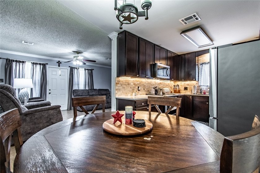 Welcome to this charming 3-bedroom, 2-bath home in the highly - photo 12