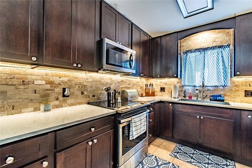 Welcome to this charming 3-bedroom, 2-bath home in the highly - photo 13