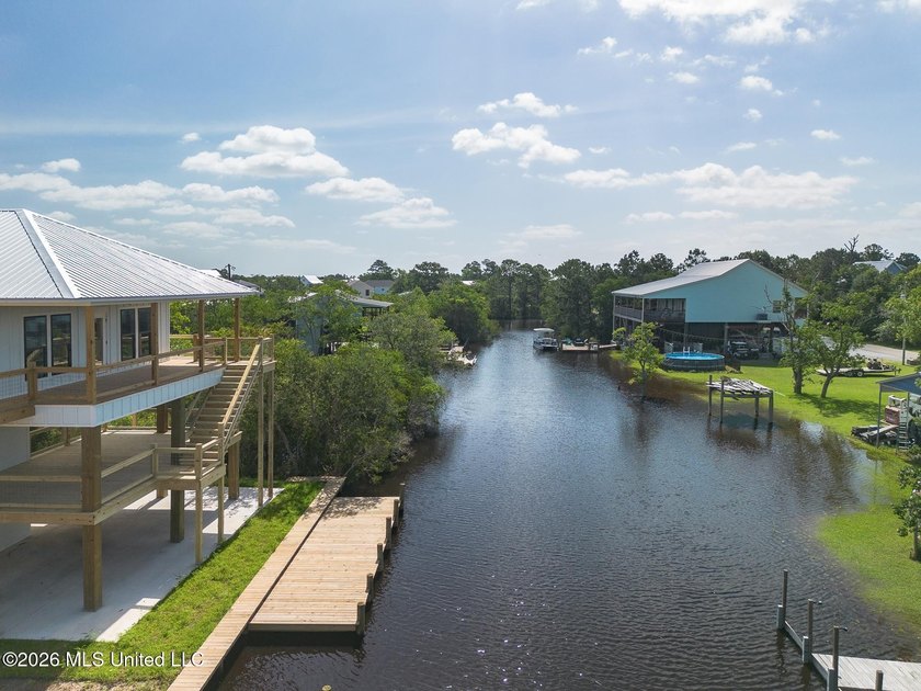 Welcome to this stunning new construction waterfront home! This - photo 29