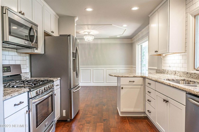 This beautiful, renovated ranch home is ideally situated on the - photo 8