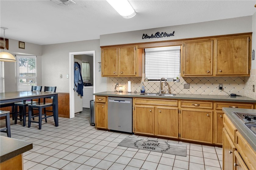 Welcome to this well-maintained 4-bedroom, 2-bath home in the - photo 13
