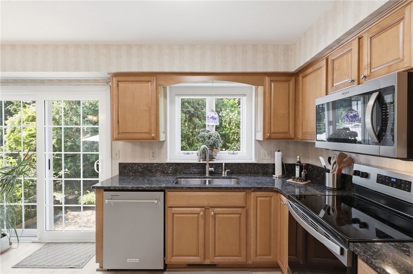 Welcome to this sparkling, move-in ready end-unit townhome in - photo 8