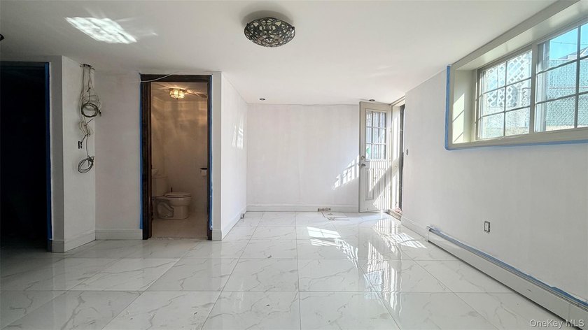 This charming one-family home offers three bedrooms, two and a - photo 18