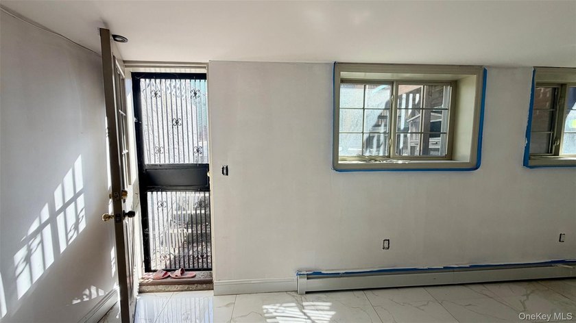 This charming one-family home offers three bedrooms, two and a - photo 20