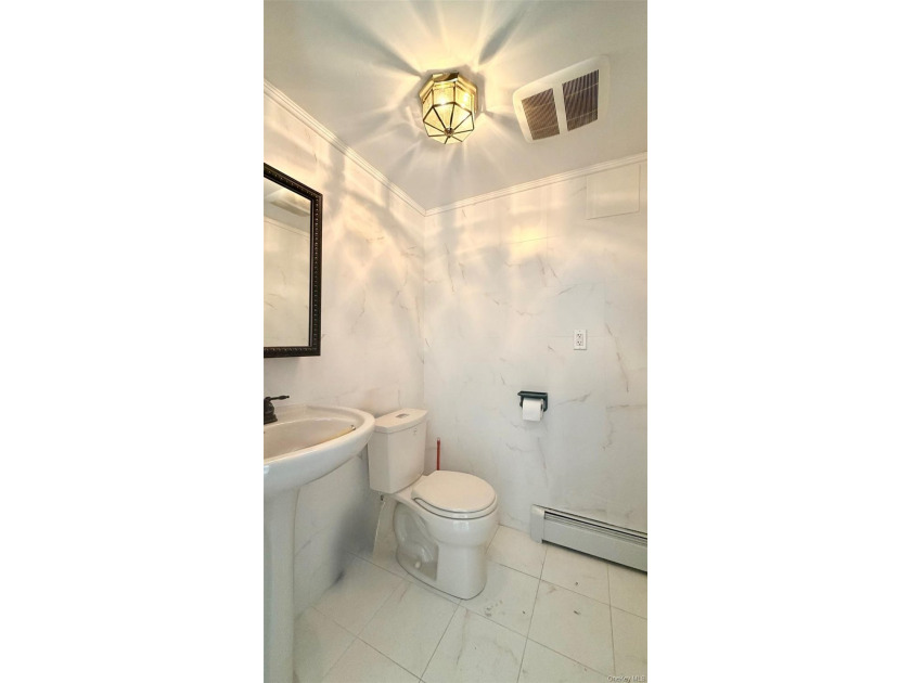 This charming one-family home offers three bedrooms, two and a - photo 21