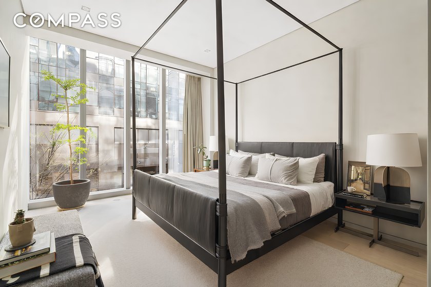 Floor to ceiling windows flood this home with exceptional - photo 9