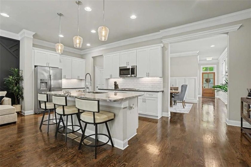 Experience elevated living in this exquisitely updated endunit - photo 4