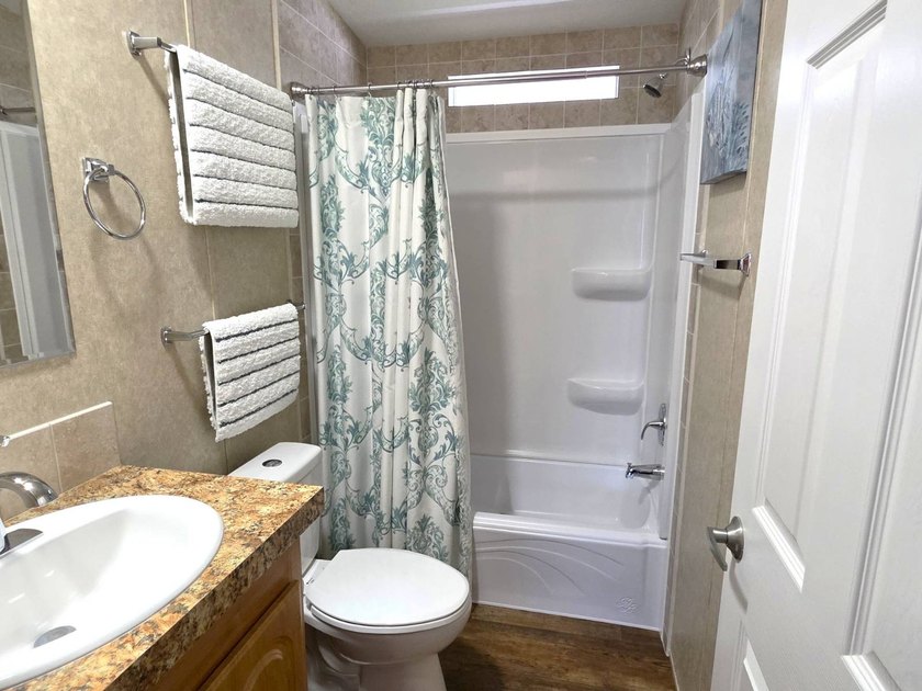 THIS HOME IS ON LEASED LAND WITH A MONTHLY LOT RENT OF $453 AND - photo 50