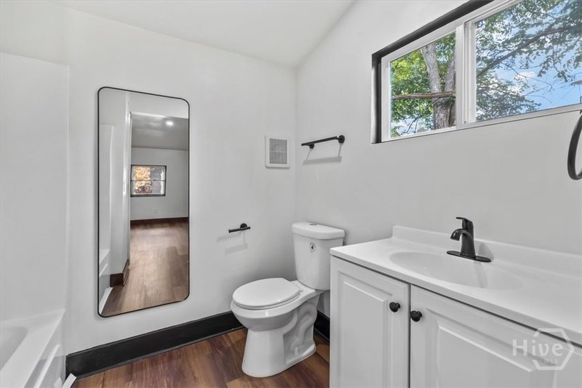 Welcome to 604 W. 40th Street, where timeless charm meets modern - photo 33
