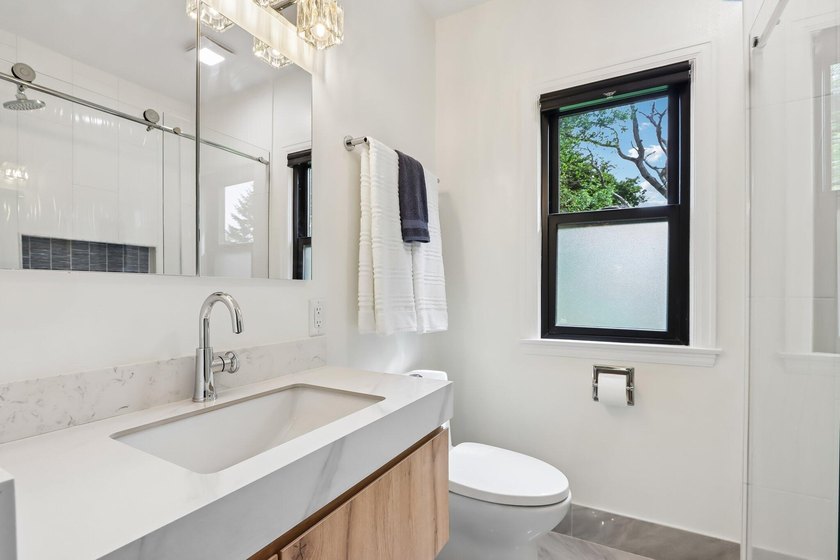 Stunning remodeled Cape Cod on Big Muskego Lake offering a rare - photo 16