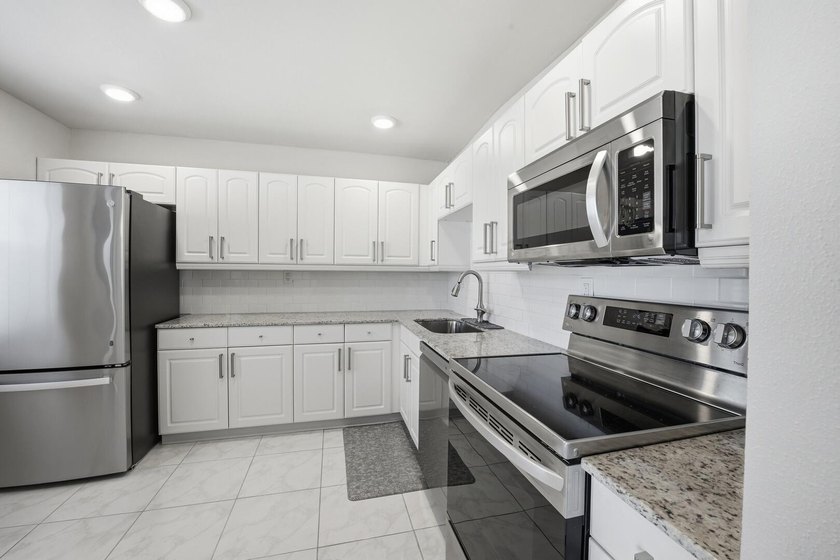 Step into this deluxe, completely renovated model featuring an - photo 16