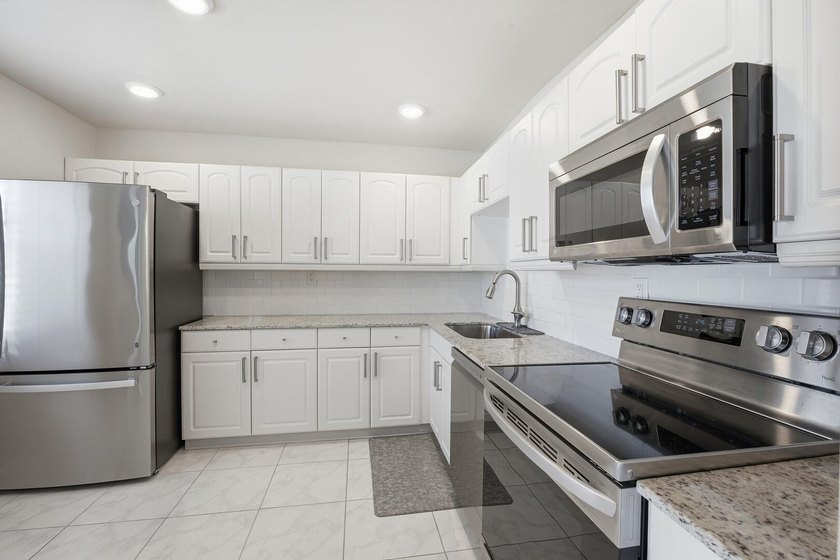 Step into this deluxe, completely renovated model featuring an - photo 17
