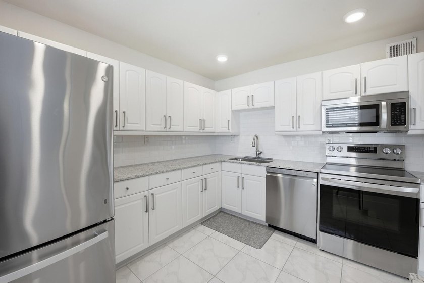 Step into this deluxe, completely renovated model featuring an - photo 20